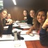 A good group of girlfriends show their love at dinner.