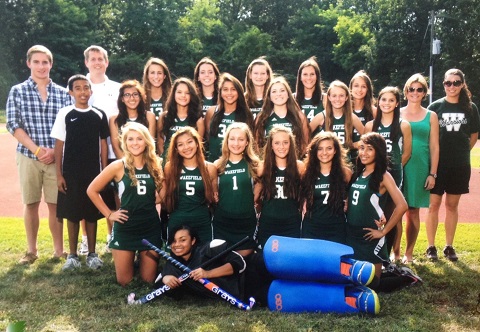 Coach Grouse (in the green dress on the top right) and her team of Warriors.