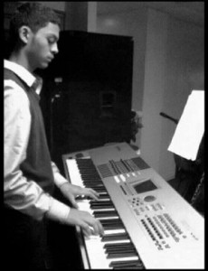 Josue Castro ’16 reads music notes while practicing on his keyboard.