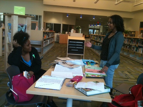 Sara Coleman 14 and Melliana Mulugeta 15 talk about the workload for upperclassmen as the library starts to close. 