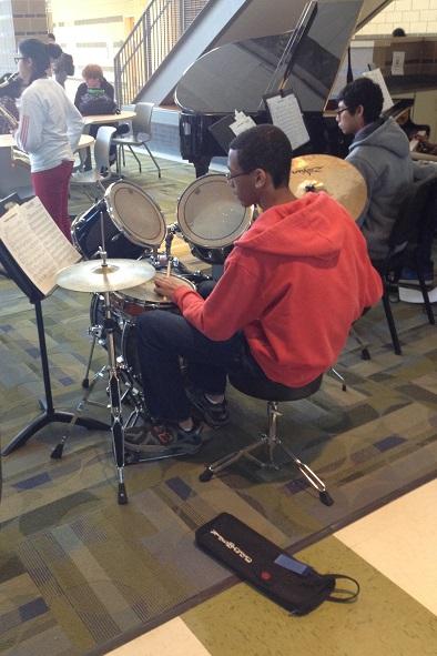 Malcolm Taylor '15 reads music notes at an impromptu Second Lunch Concert the day before winter break.