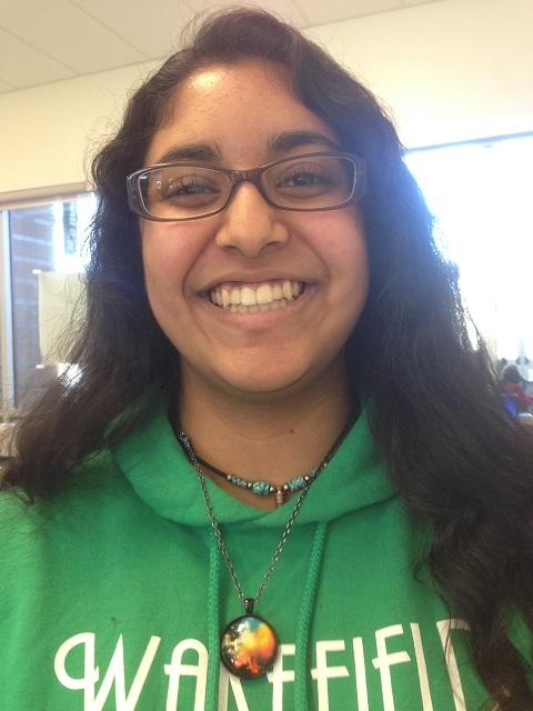 Maryam rocks a full moon necklace she purchased on etsy.com. 