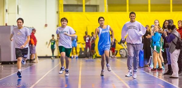 The 55-meter sprint during indoor track meet at Thomas Jefferson Middle School, Friday night, January 24, 2014. (L-R): Huan Vuong, James Crandall, Will Waddell, Nicholas Jones.