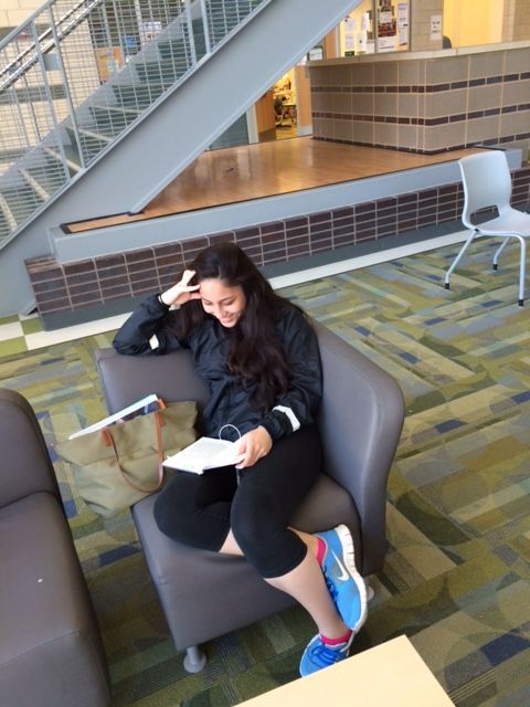 Senior Grisel Vasquez - Parelle reading in Town Hall to begin the day. 