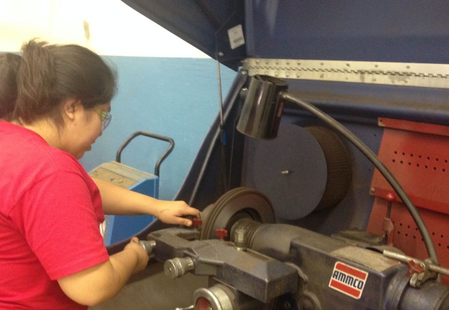 Karla Reyes repairs parts in Auto Tech 1 at the Career Center.