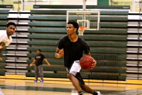 Senior Alex Sentayhu pushing the ball up the court 