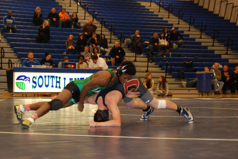 Deangelo Jones controls an Oakton Opponent.