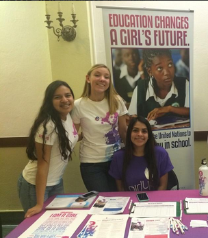 President Rebecca Bean (center) with Girl Up Club members Teresa Larios (left) and Nancy Lazo at an event in Baltimore earlier this year. 