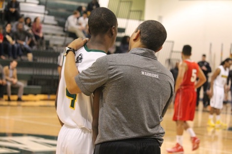 Senior Drew Simpson and Coach Bentley talking on the sideline.