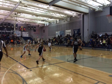 Sophomore Hailey Finlay pushes the ball down the court.