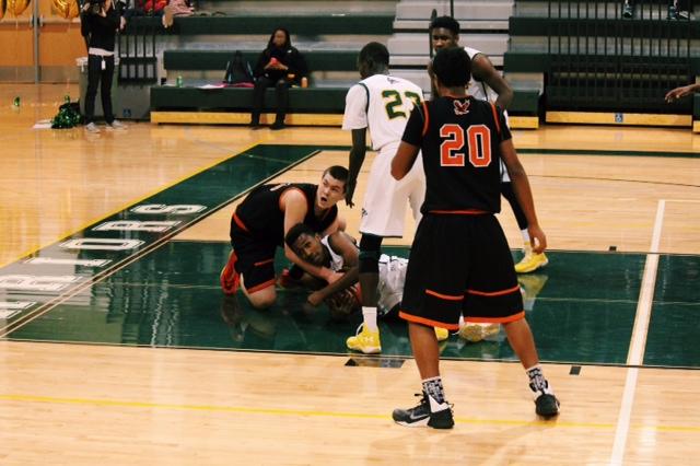 Both teams fight for the ball just before half time. 