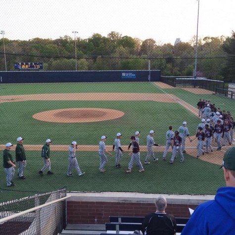 The Warriors shake hands with the Majors after the win.