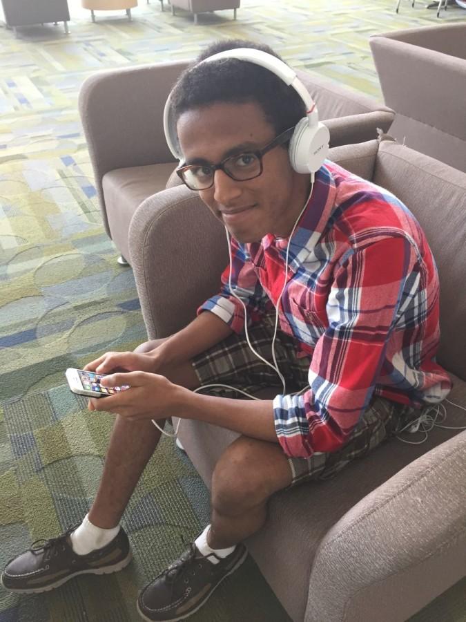 Sophomore Wael Saleh listens to music in Town Hall after school. 