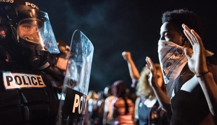 Police officers face off with protesters on the I-85 (Interstate 85) during protests in the early hours of September 21, 2016 in Charlotte, North Carolina. 