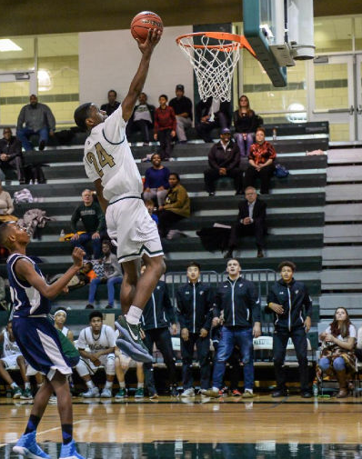 Halil Parks finishes off a wide-open layup at home against Lee.