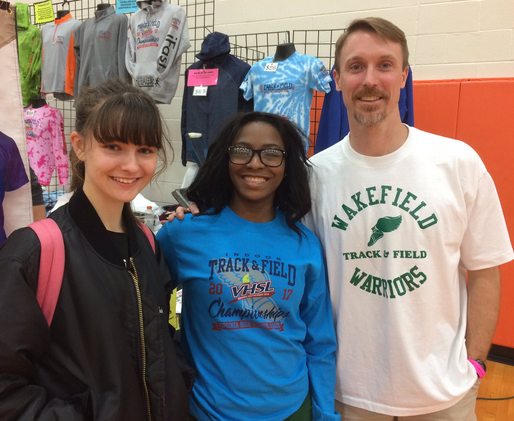 Cierra Jenkins (center) is all smiles after running the 55m dash at States on Friday. 