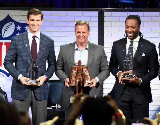 NFL Commissioner, Roger Goodell in between the recipients of the Walter Payton Man of the Year Award. 