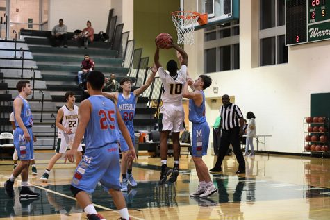 Sophomore, Zion Gladden goes up for a shot against Marshall.