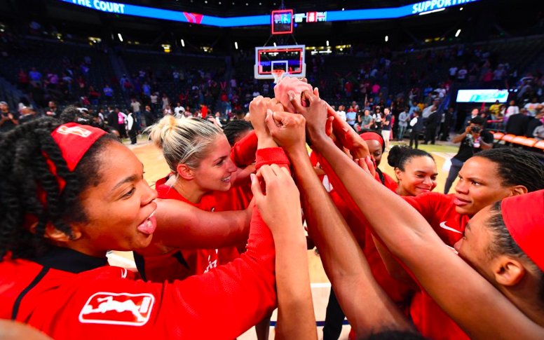 The Mystics huddle up after their win to send them to the WNBA Finals
