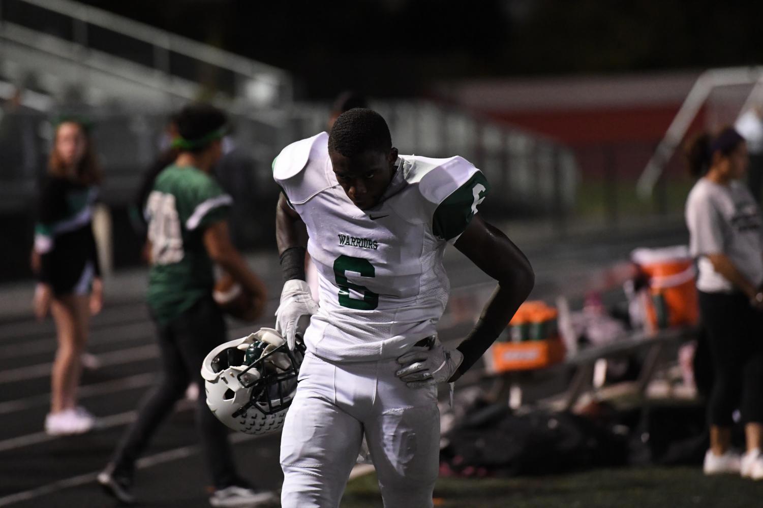 Senior Jaleel Prather steps off the field in between possessions to catch his breath.