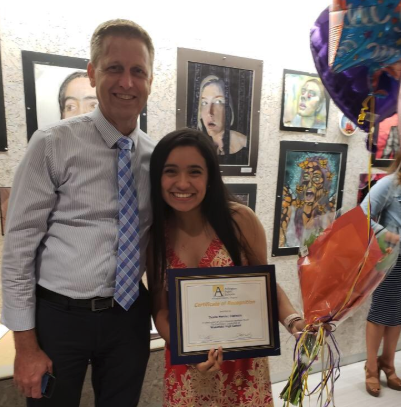 Ileana getting the award with Dr. Willmore.