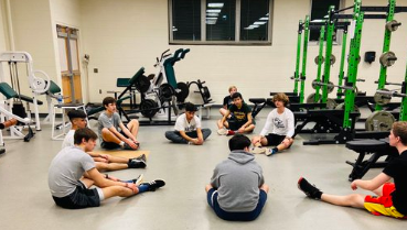 Boys Lacrosse conditioning in the weight room before the official start of the season next week.