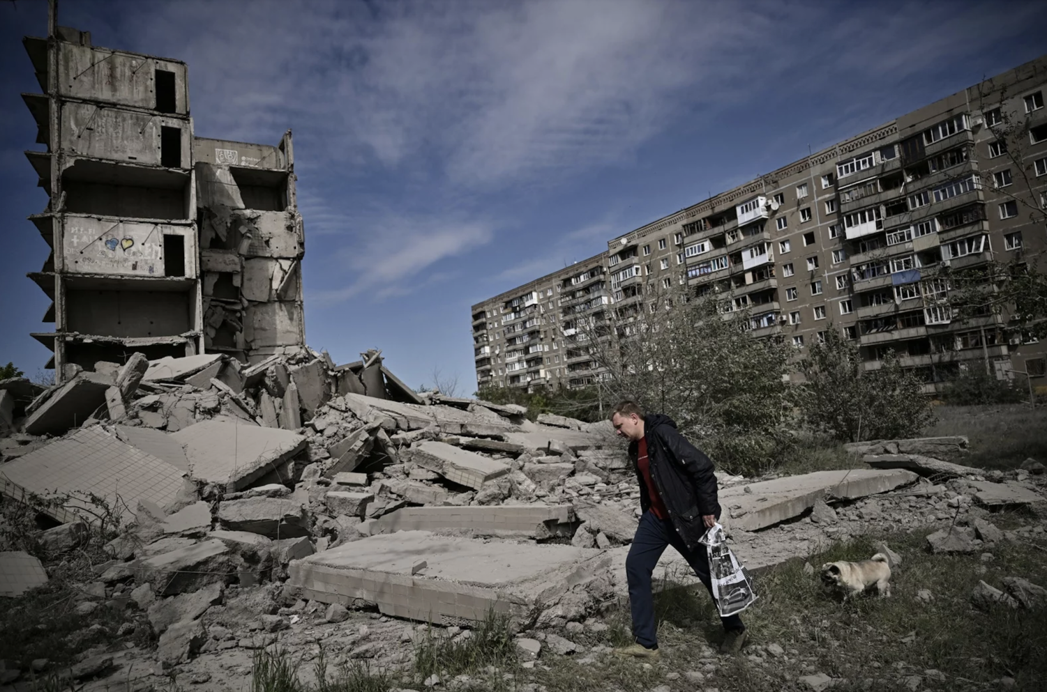 A man walks past a damaged building after a strike in Kramatorsk in the eastern Ukrainian region of Donbas, on Wednesday.
